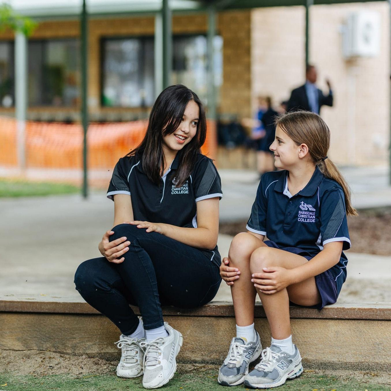 Primary and secondary students chatting together in the school playground during a tour of Bairnsdale Christian College.
