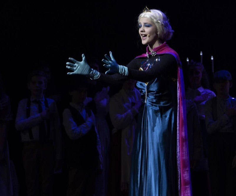 Frozen musical Elsa singing with arms outstretched